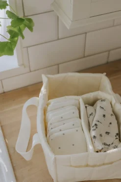 Online Blöjhållare Creamy White Baby Sköta